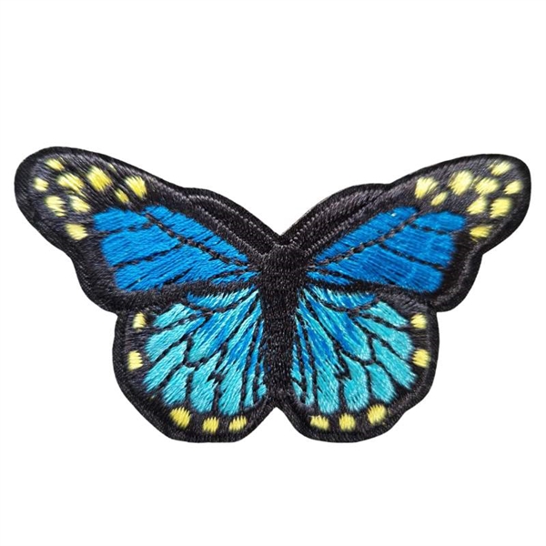 Symærke sommerfugl blå/sort 7,5x5 cm.